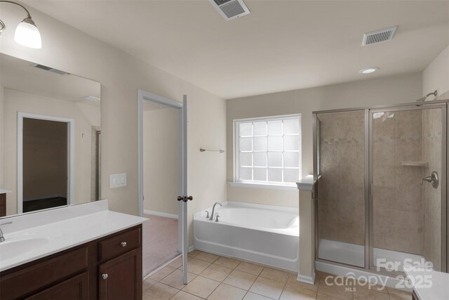 11538 Ardrey Crest Dr, Charlotte, NC 28277 - bathroom with vanity, tile patterned floors, a garden tub, and a shower stall