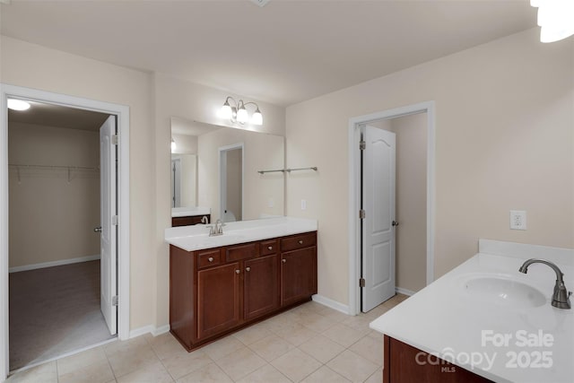 11538 Ardrey Crest Dr, Charlotte, NC 28277 - full bath with two vanities, tile patterned floors, and a spacious closet