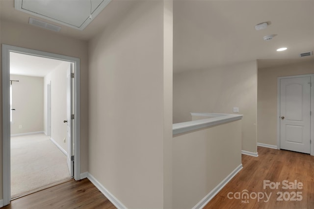 11538 Ardrey Crest Dr, Charlotte, NC 28277 - hallway with attic access, wood finished floors, recessed lighting, and an upstairs landing