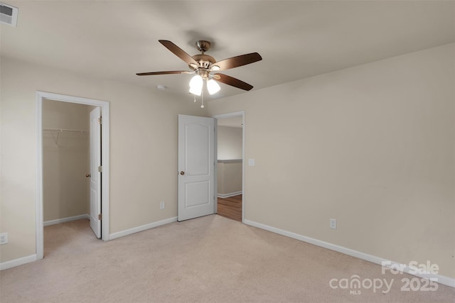 11538 Ardrey Crest Dr, Charlotte, NC 28277 - unfurnished bedroom featuring light colored carpet, a spacious closet, a closet, and a ceiling fan