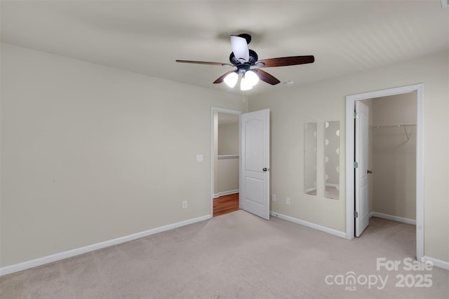11538 Ardrey Crest Dr, Charlotte, NC 28277 - unfurnished bedroom with light carpet, a walk in closet, a closet, and ceiling fan