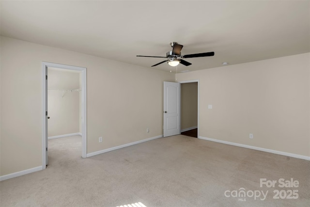 11538 Ardrey Crest Dr, Charlotte, NC 28277 - unfurnished bedroom featuring carpet floors, a walk in closet, a ceiling fan, and a closet