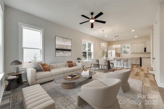 513 Sacco St, Belmont, NC 28012 - living room with light wood-type flooring, ceiling fan, and recessed lighting