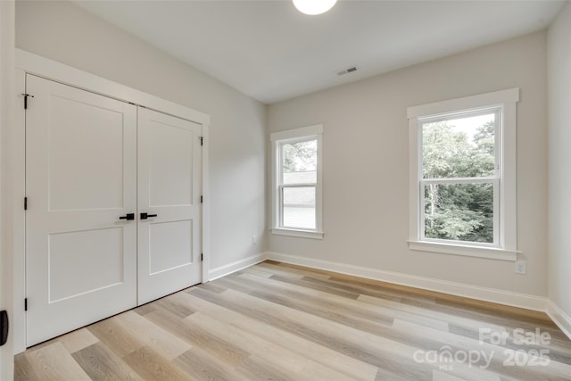 513 Sacco St, Belmont, NC 28012 - unfurnished bedroom with light wood-style floors and a closet