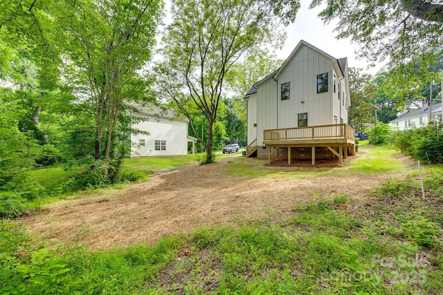 513 Sacco St, Belmont, NC 28012 - back of property featuring board and batten siding and a wooden deck
