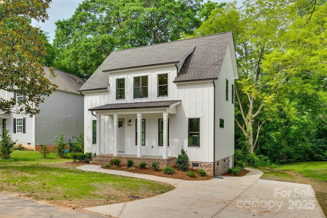 513 Sacco St, Belmont, NC 28012 - modern farmhouse style home featuring a shingled roof, covered porch, crawl space, and board and batten siding