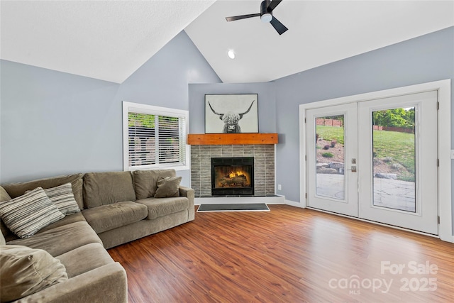 344 Hemlock Springs Trl, Weaverville, NC 28787 - living area with ceiling fan, wood finished floors, high vaulted ceiling, french doors, and a tile fireplace