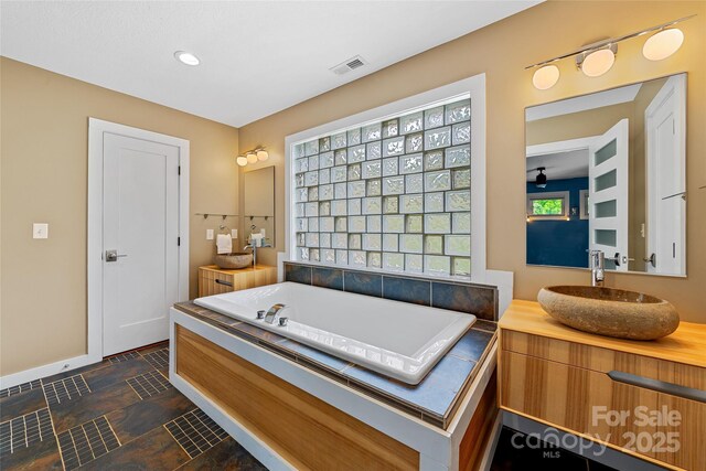 344 Hemlock Springs Trl, Weaverville, NC 28787 - full bathroom featuring a bath, vanity, and stone finish flooring