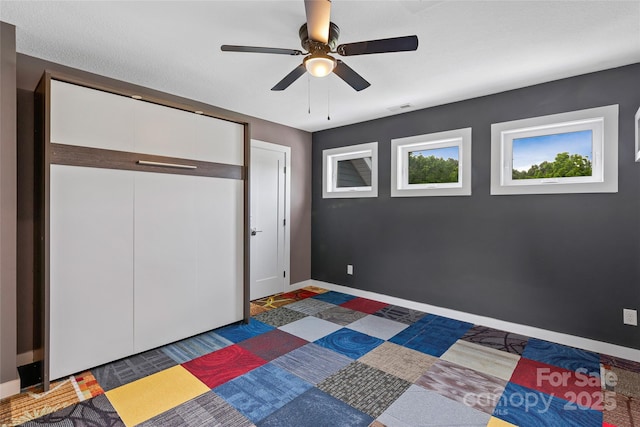 344 Hemlock Springs Trl, Weaverville, NC 28787 - unfurnished bedroom with ceiling fan and a closet
