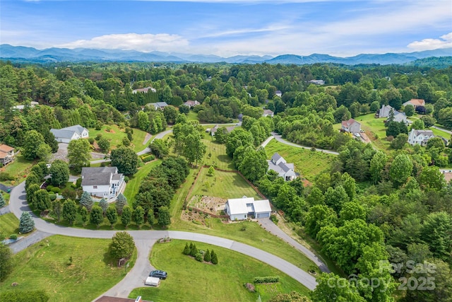 344 Hemlock Springs Trl, Weaverville, NC 28787 - drone / aerial view of a mountain backdrop and a heavily wooded area