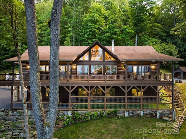 242 Anisidi Trl, Maggie Valley, NC 28751 - back of property with a wooden deck and roof with shingles
