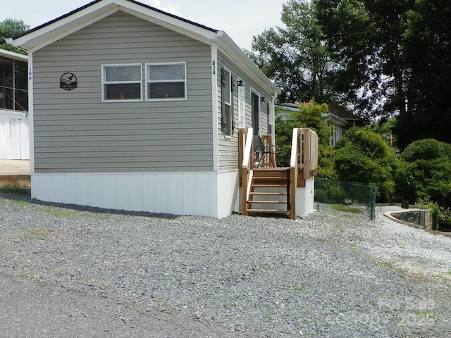 166 Eagle Dr, New London, NC 28127 - view of side of property with a wooden deck