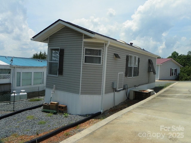 166 Eagle Dr, New London, NC 28127 - view of property exterior with a cooling unit