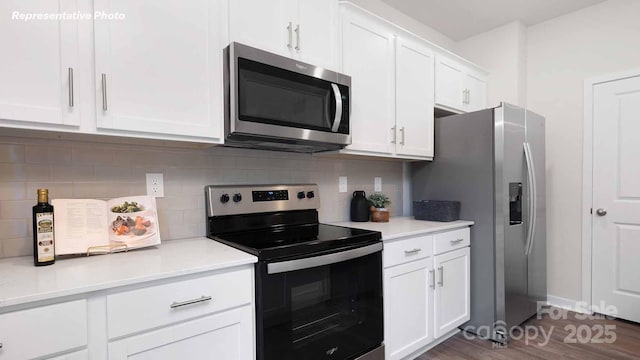 780 14th Avenue Ct NE, Hickory, NC 28601 - kitchen featuring appliances with stainless steel finishes, white cabinets, light countertops, and decorative backsplash