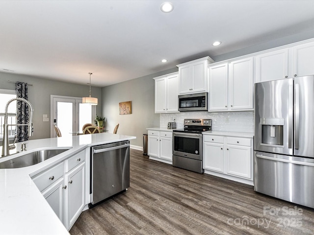 2003 Trigger Dr, Indian Trail, NC 28079 - kitchen with stainless steel appliances, white cabinetry, light countertops, and recessed lighting