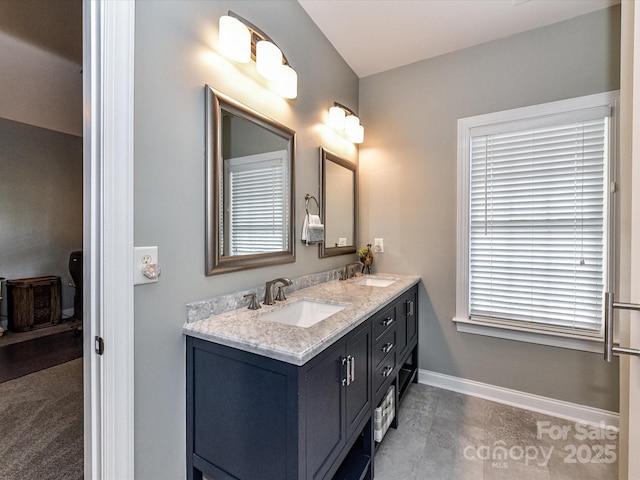 2003 Trigger Dr, Indian Trail, NC 28079 - bathroom featuring double vanity and baseboards