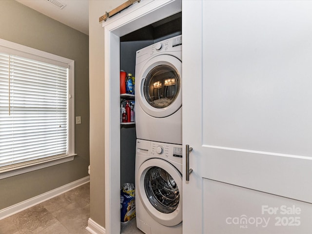 2003 Trigger Dr, Indian Trail, NC 28079 - laundry area with stacked washer / drying machine and baseboards