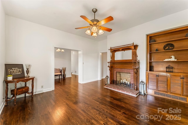 302 White St, Morganton, NC 28655 - living area with a ceiling fan, wood finished floors, and a fireplace