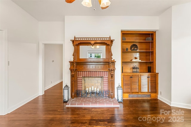 302 White St, Morganton, NC 28655 - unfurnished living room featuring wood finished floors, ceiling fan, and a fireplace