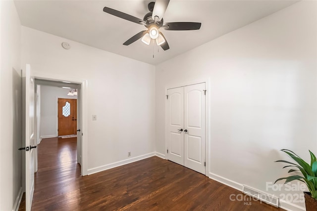 302 White St, Morganton, NC 28655 - unfurnished room with dark wood-style flooring, a ceiling fan, and a smoke detector