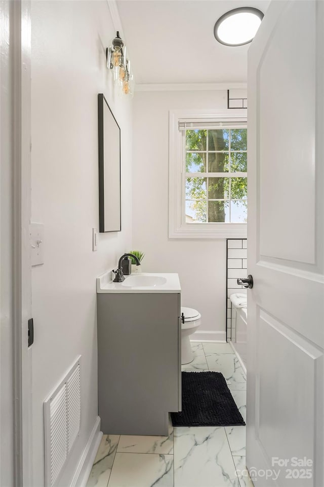 302 White St, Morganton, NC 28655 - bathroom with marble look tile flooring, vanity, and ornamental molding