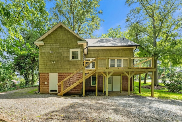 302 White St, Morganton, NC 28655 - view of front of property with driveway, a deck, and a carport