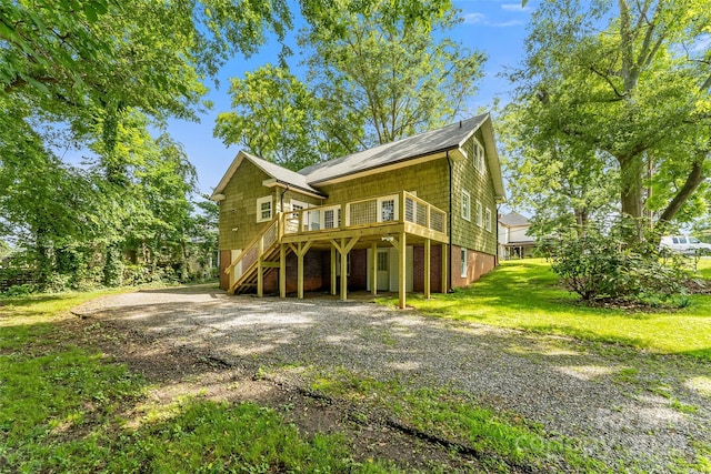 302 White St, Morganton, NC 28655 - view of front facade featuring a front lawn, stairway, driveway, and a wooden deck