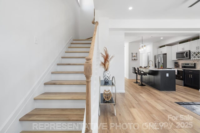 213 Knot St, Shelby, NC 28150 - staircase with wood finished floors and recessed lighting