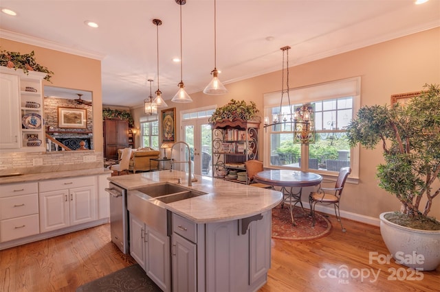 94 Spruce Hill Dr, Hendersonville, NC 28792 - kitchen with light wood-type flooring, white cabinetry, stainless steel dishwasher, recessed lighting, and ornamental molding