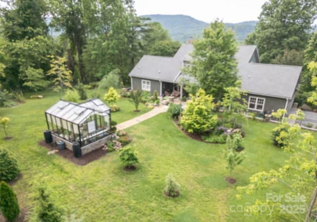 94 Spruce Hill Dr, Hendersonville, NC 28792 - aerial view of property and surrounding area featuring a mountainous background