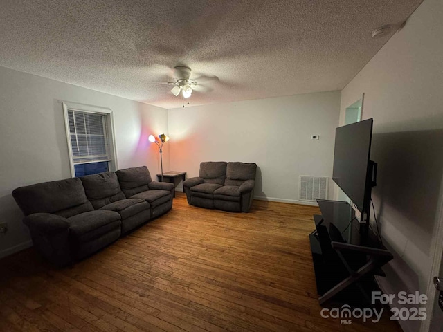 128 Pine St, Shelby, NC 28152 - living area with a ceiling fan, hardwood / wood-style flooring, and a textured ceiling