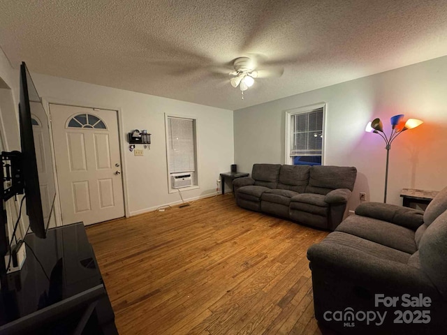 128 Pine St, Shelby, NC 28152 - living room with hardwood / wood-style flooring, ceiling fan, a textured ceiling, and cooling unit