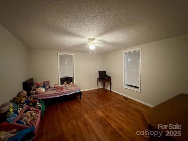 128 Pine St, Shelby, NC 28152 - living area with wood finished floors, a ceiling fan, and a textured ceiling