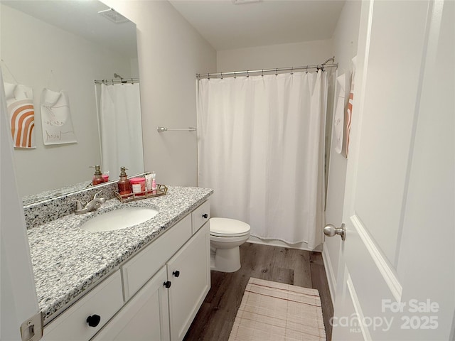 103 Springway Dr, Kannapolis, NC 28081 - bathroom with wood finished floors, vanity, and a shower with shower curtain