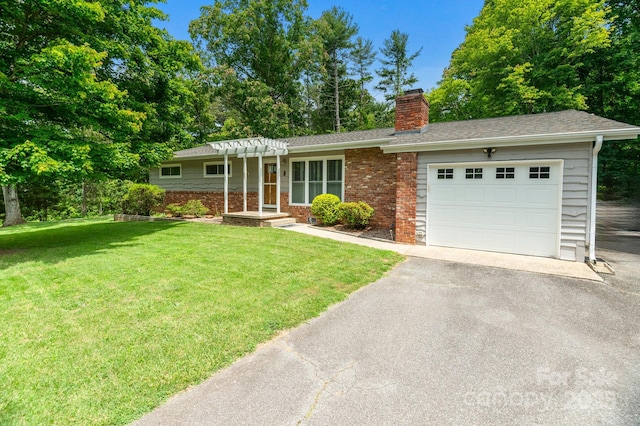 4 Sourwood Ln E, Asheville, NC 28805 - single story home featuring a garage, a chimney, asphalt driveway, brick siding, and a front yard