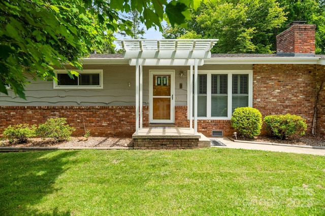 4 Sourwood Ln E, Asheville, NC 28805 - view of front facade featuring a front yard, brick siding, a pergola, and a chimney