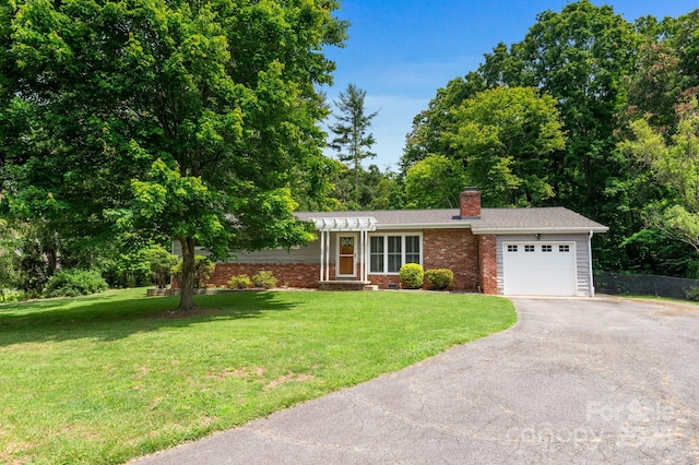 4 Sourwood Ln E, Asheville, NC 28805 - ranch-style house featuring a garage, driveway, a chimney, and a front yard