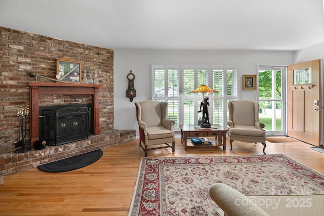 4 Sourwood Ln E, Asheville, NC 28805 - living room with wood finished floors and a brick fireplace
