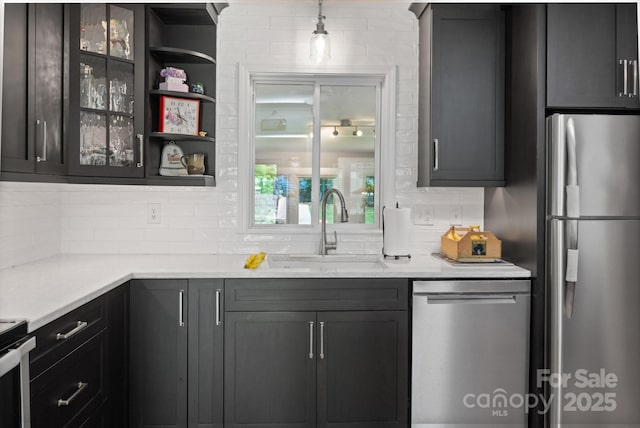4 Sourwood Ln E, Asheville, NC 28805 - kitchen with appliances with stainless steel finishes, tasteful backsplash, and light countertops