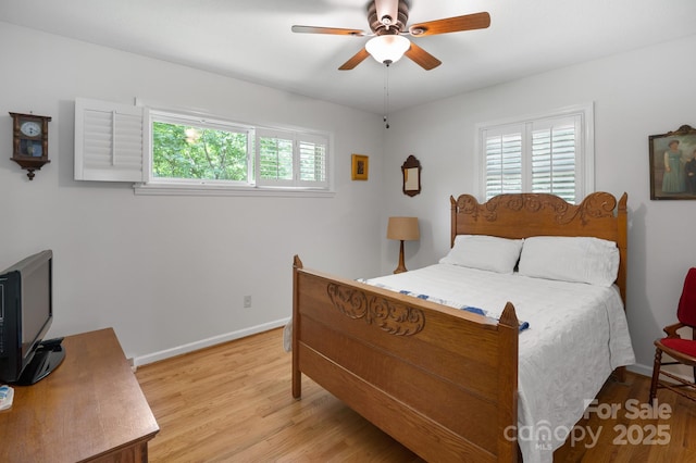 4 Sourwood Ln E, Asheville, NC 28805 - bedroom with light wood-type flooring and ceiling fan