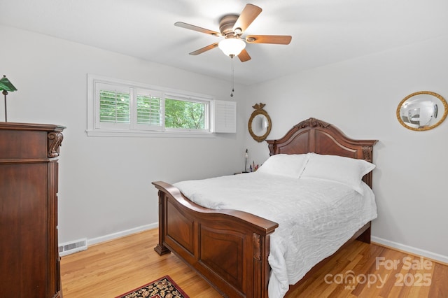 4 Sourwood Ln E, Asheville, NC 28805 - bedroom featuring light wood-type flooring and ceiling fan