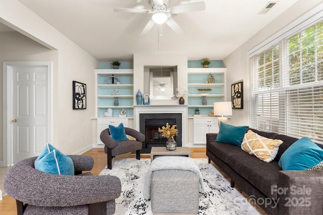 4442 Coventry Row Ct, Charlotte, NC 28270 - living room featuring ceiling fan, wood finished floors, and a fireplace