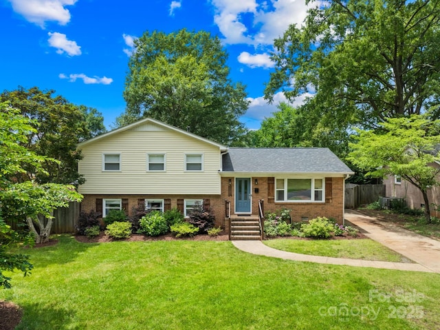 2919 Dunaire Dr, Charlotte, NC 28205 - tri-level home with brick siding, concrete driveway, and roof with shingles
