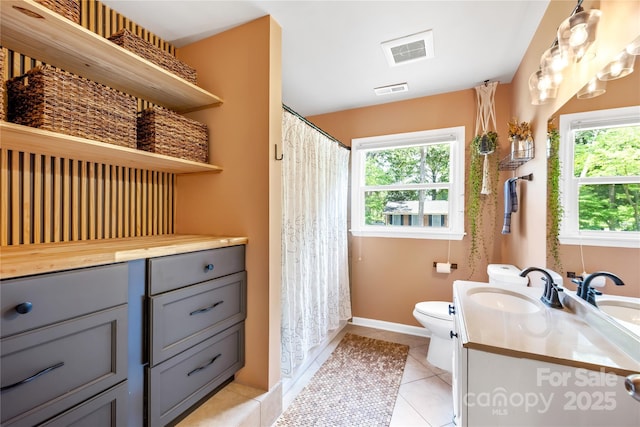 2919 Dunaire Dr, Charlotte, NC 28205 - full bath with vanity, tile patterned flooring, and a shower with shower curtain