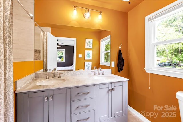 2919 Dunaire Dr, Charlotte, NC 28205 - bathroom with double vanity, healthy amount of natural light, ensuite bath, and a shower with curtain