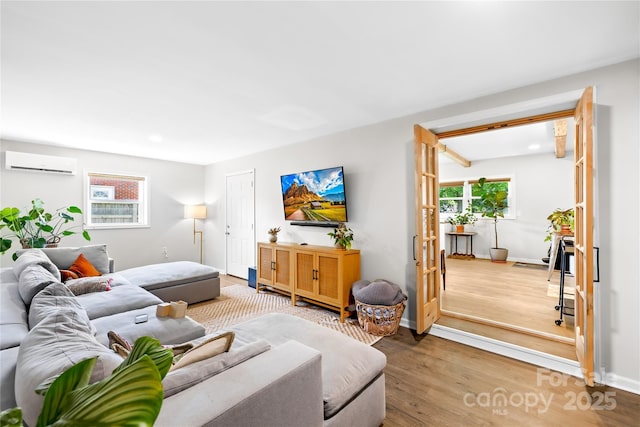 2919 Dunaire Dr, Charlotte, NC 28205 - living room featuring a wall mounted AC, wood finished floors, and recessed lighting
