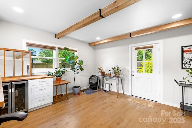 2919 Dunaire Dr, Charlotte, NC 28205 - office with light wood finished floors, beam ceiling, healthy amount of natural light, a dry bar, and beverage cooler