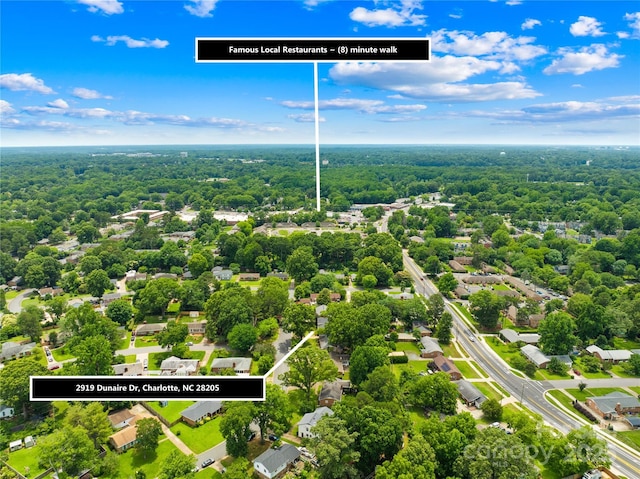 2919 Dunaire Dr, Charlotte, NC 28205 - aerial view of property and surrounding area with a heavily wooded area and property boundaries highlighted