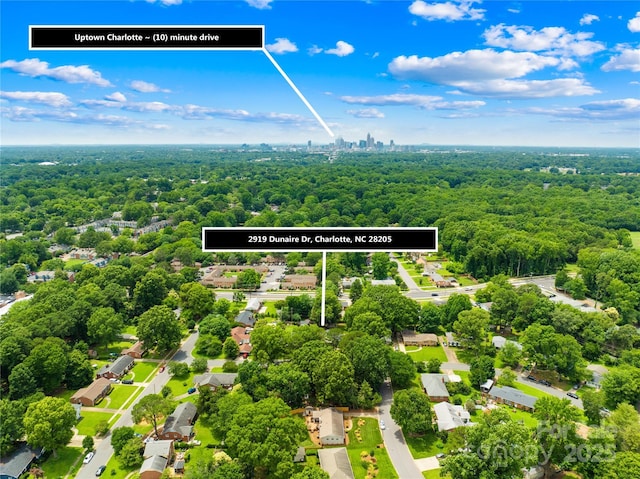 2919 Dunaire Dr, Charlotte, NC 28205 - aerial view of residential area with a heavily wooded area and property parcel outlined