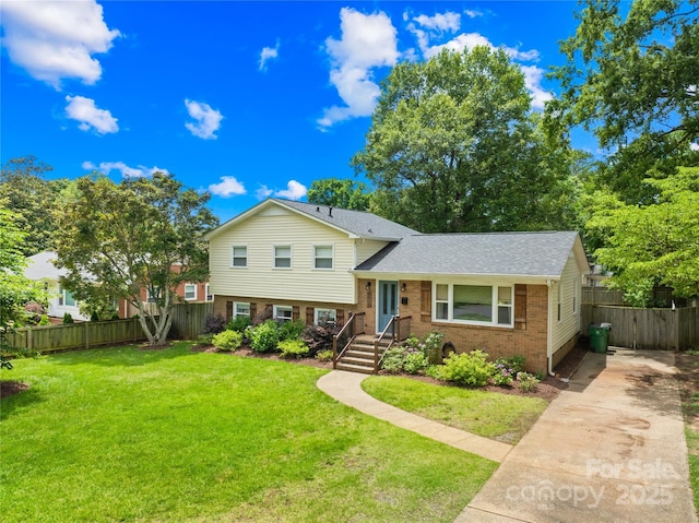 2919 Dunaire Dr, Charlotte, NC 28205 - tri-level home with brick siding, roof with shingles, and driveway